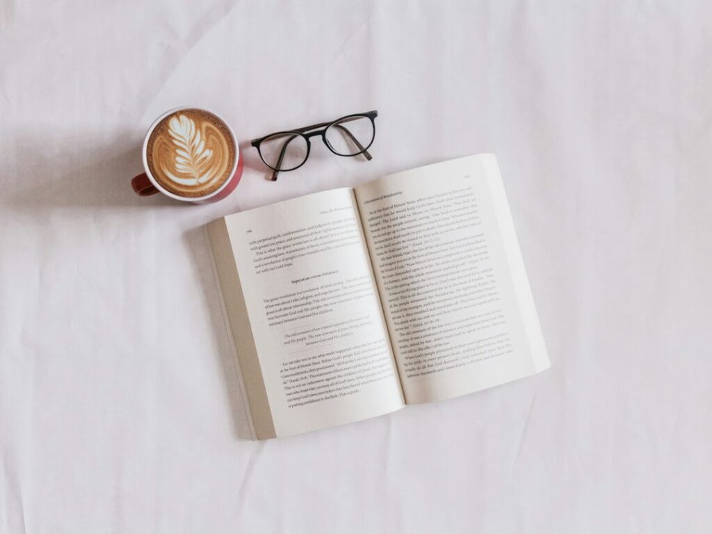 A book and coffee on a table, representing brief stories with lasting moral lessons