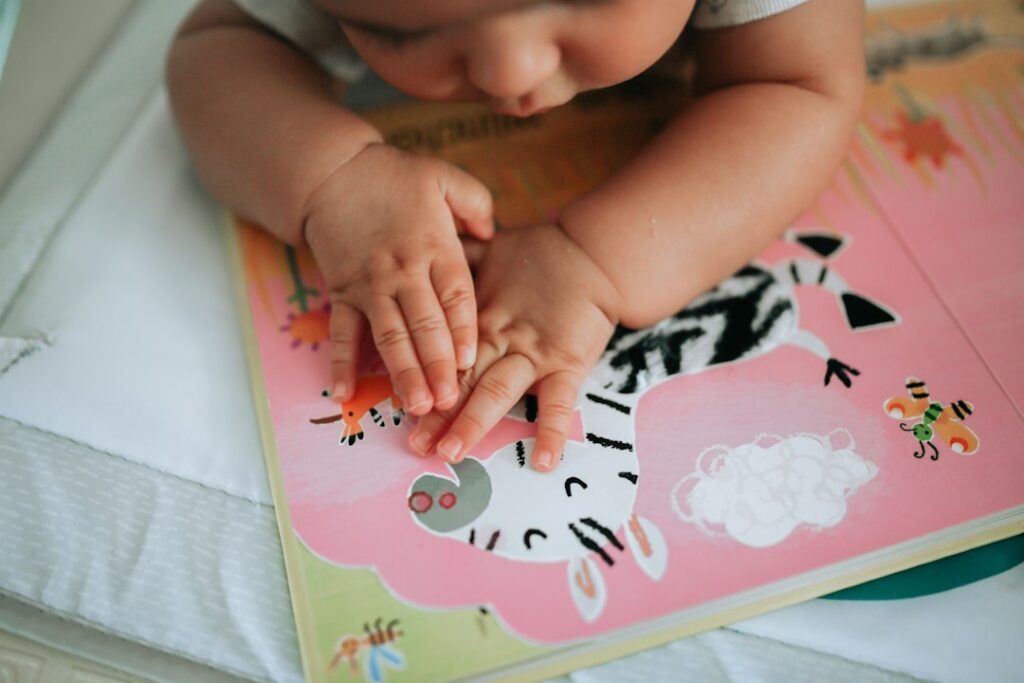 A young child exploring an illustrated book, representing how parents choose meaningful stories for children