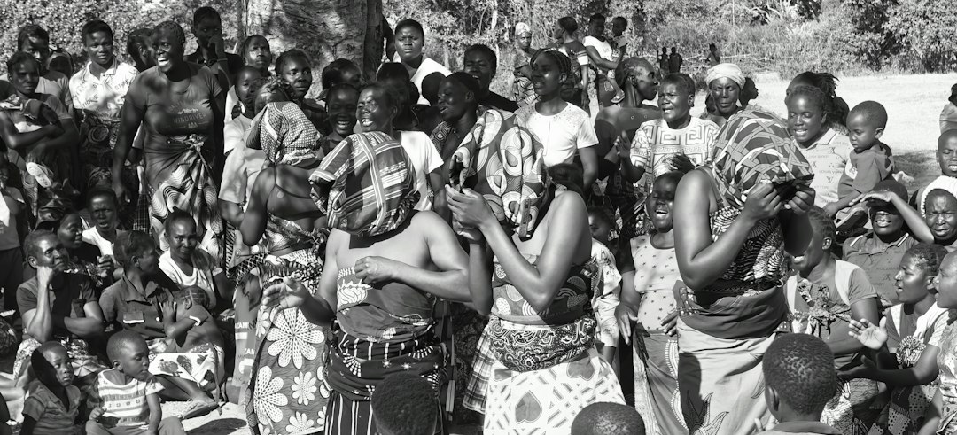 Community gathering illustrating shared wisdom, oral storytelling and collective experience
