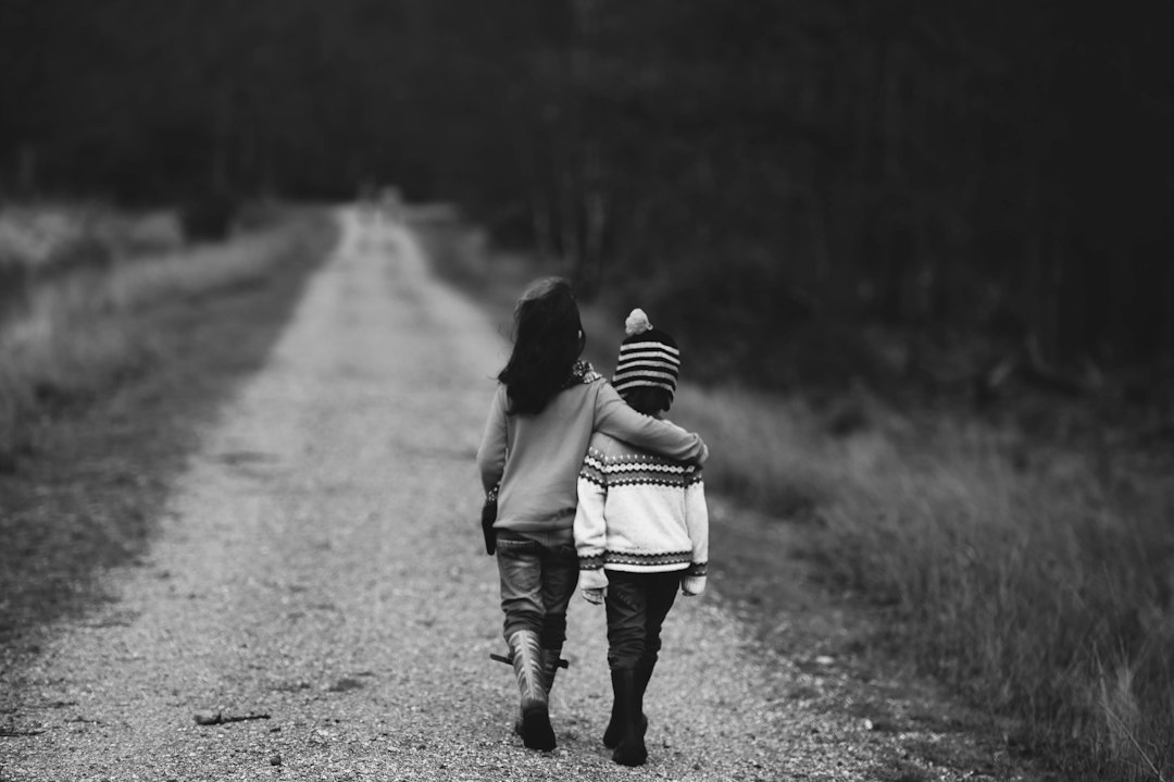 Children together outdoors, representing kindness, empathy and supportive friendship