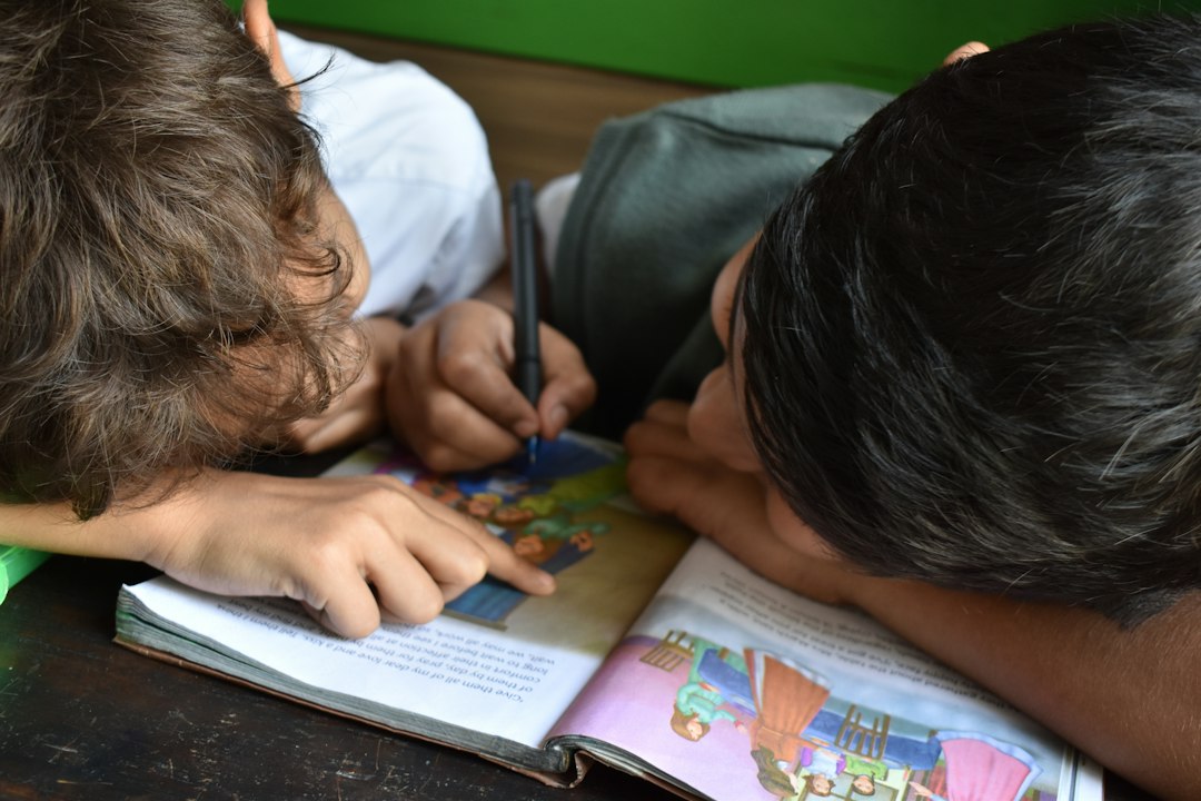 Child writing in a book